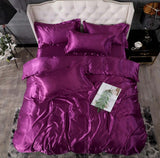 Luxurious purple silk bed sheet quilt cover set with matching pillows for a stylish bedroom decor.
