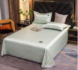 Ice Silk Bed Sheet Quilt Cover Pillowcase set in cool green, offering a solid color with a smooth, luxurious feel.