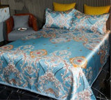 Ice Silk Bed Sheet Quilt Cover with decorative pillows in elegant blue pattern, providing a cool and stylish bedroom look.