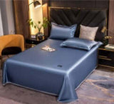 Ice Silk Bed Sheet Quilt Cover Pillowcase in Bentley Blue color on a stylish bed, showcasing a cool and solid feel.