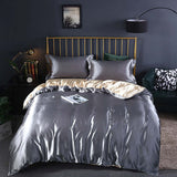 Summer Simple Pure Color Ice Silk Bed Linen Quilt Cover Bedding in gray with matching pillows on a stylish bed.