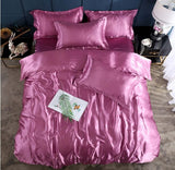 Elegant satin bed sheet quilt cover in pink with matching pillows, perfect for a cool and stylish sleep.