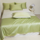 Washed Ice Silk Solid Color Silky Sleep Naked Bed Sheet Quilt Cover Fitted Sheet in green on a bed.