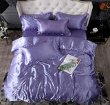 Luxurious purple silk bedding set featuring a quilt cover and decorative pillows for elegant bedroom decor.