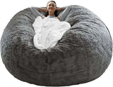 Cozy woman relaxing in a dark grey bag chair cover, showcasing its soft, fluffy PV velvet texture and comfort.