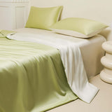 Washed Ice Silk Solid Color Silky Sleep Naked Bed Sheet and Pillow Covers in pastel green and white.