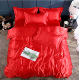 Bed Sheet Quilt Cover Naked Sleep Cool Silk Single Three Piece Set in vibrant red, featuring sleek satin texture and decorative pillows.