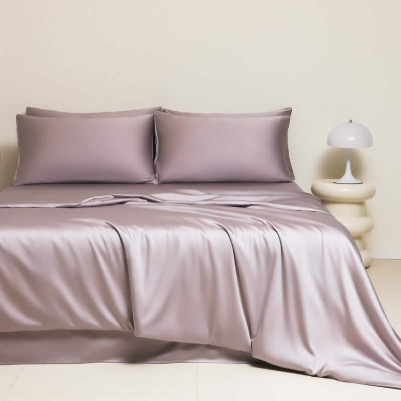 Washed Ice Silk Solid Color Silky Sleep Naked Bed Sheet Quilt Cover with matching pillows in soft lavender shade.