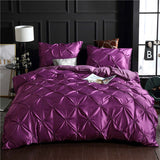 European style washed silk three-piece solid color duvet cover in purple with decorative stitching and matching pillowcases.
