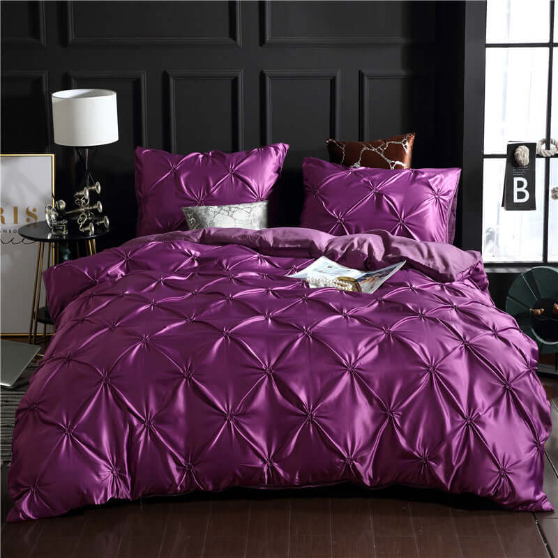 European style washed silk three-piece solid color duvet cover in purple with decorative stitching and matching pillowcases.