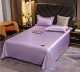 Ice Silk Bed Sheet Quilt Cover Pillowcase set in Light Purple color on a stylish bed, showcasing a modern bedroom decor.