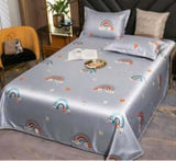 Ice Silk Bed Sheet Quilt Cover with rainbow design and matching pillowcases in a modern bedroom setting.