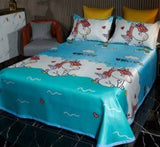 Unicorn-themed bed sheet with matching pillowcases in bright blue color and playful design, perfect for children's room.