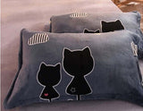 Cozy pillows with cute cat silhouettes and clouds, perfect for a modern bedroom decor.