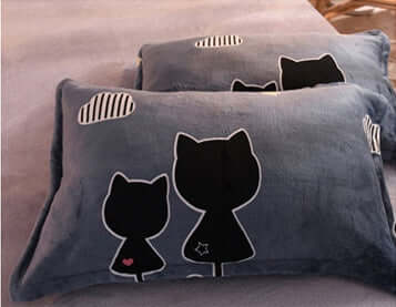 Cozy pillows with cute cat silhouettes and clouds, perfect for a modern bedroom decor.