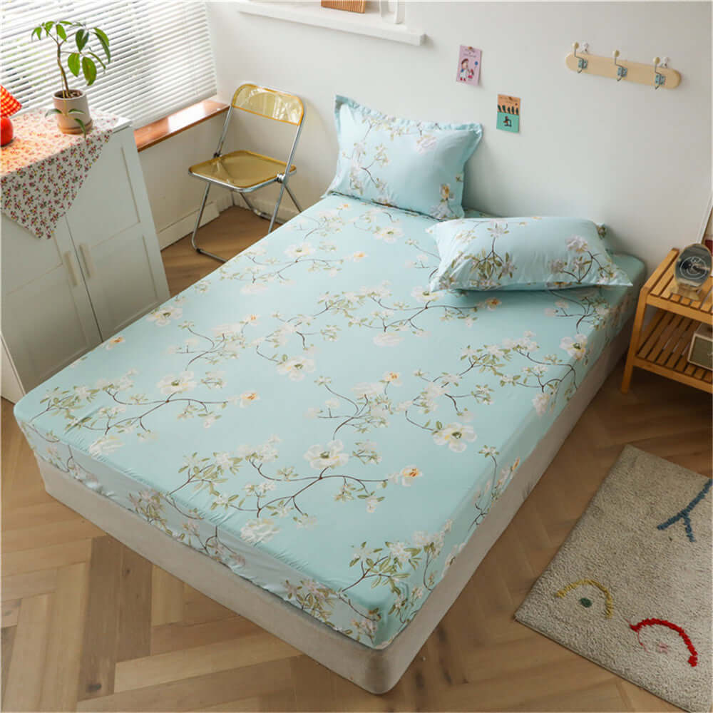 One Piece Bed Sheet Cover Aloe Cotton Simmons Non-slip Dustproof Mattress Protector in floral design on bed.