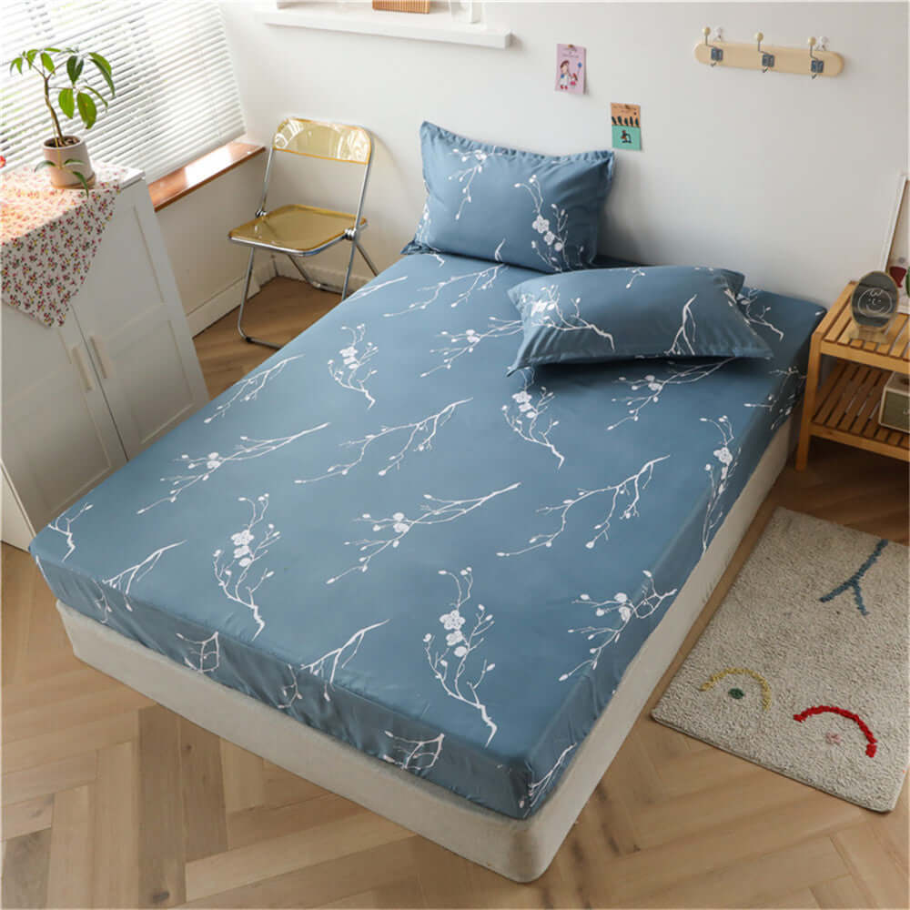 One Piece Bed Sheet Cover Aloe Cotton Simmons non-slip mattress protector with floral pattern in a cozy bedroom setting.