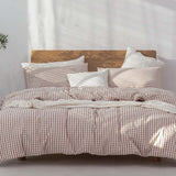 Japanese Style Muji-style Bed And Breakfast Pure Color Lattice Duvet Cover with Pillows in Cozy Bedroom Setting.