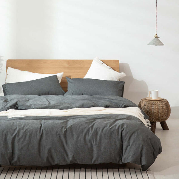 Japanese Style Muji-style bed with gray duvet cover and pillows, modern simple decor.