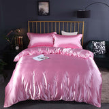 Summer Simple Pure Color Ice Silk Bed Linen Quilt Cover Bedding in pink on a modern bed.