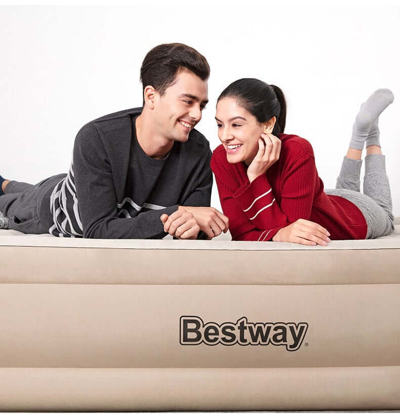 Couple enjoying comfort on a Bestway inflatable airbed, showcasing the Single Double Layer Cloth Cover design.