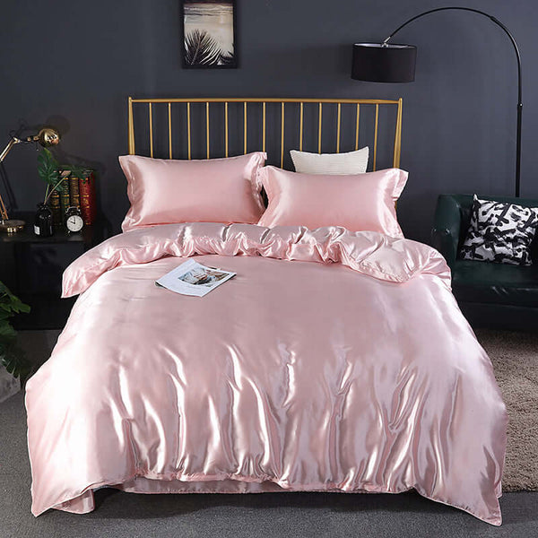 Summer Simple Pure Color Ice Silk Bed Linen Quilt Cover Bedding in soft pink, beautifully arranged on a stylish bed.
