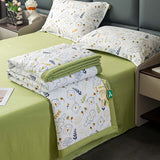 Cotton and linen double-layer yarn summer blanket set on a bed with decorative pillows in a modern room.