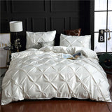 European style washed silk three-piece solid color bed sheet and duvet cover set in elegant white.