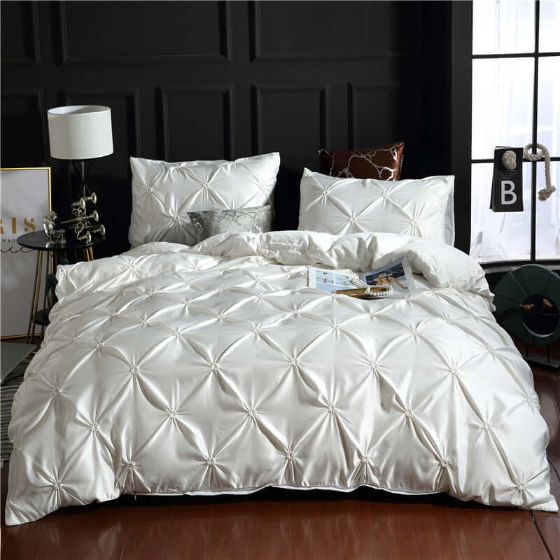 European style washed silk three-piece solid color bed sheet and duvet cover set in elegant white.