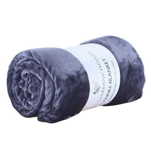 Rolled flannel coral fleece blanket in dark gray color with elegant label, ideal for air conditioning use.