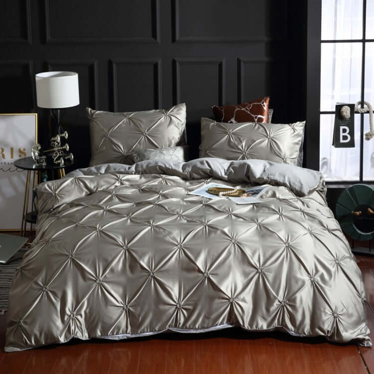 European style washed silk three-piece solid color bed sheet duvet cover with decorative stitching in a stylish bedroom.