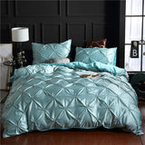 European style washed silk three-piece solid color duvet cover set in light blue with decorative pillowcases.