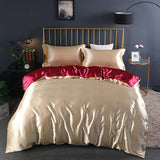 Summer Simple Pure Color Ice Silk Bed Linen Quilt Cover Bedding in champagne gold with red accents on a stylish bed.