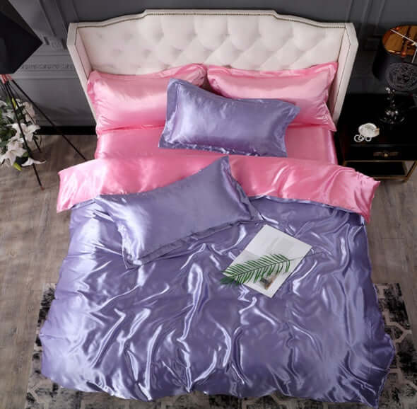 Luxurious pink and purple silk bed sheet quilt cover set, perfect for a cool and elegant bedroom.