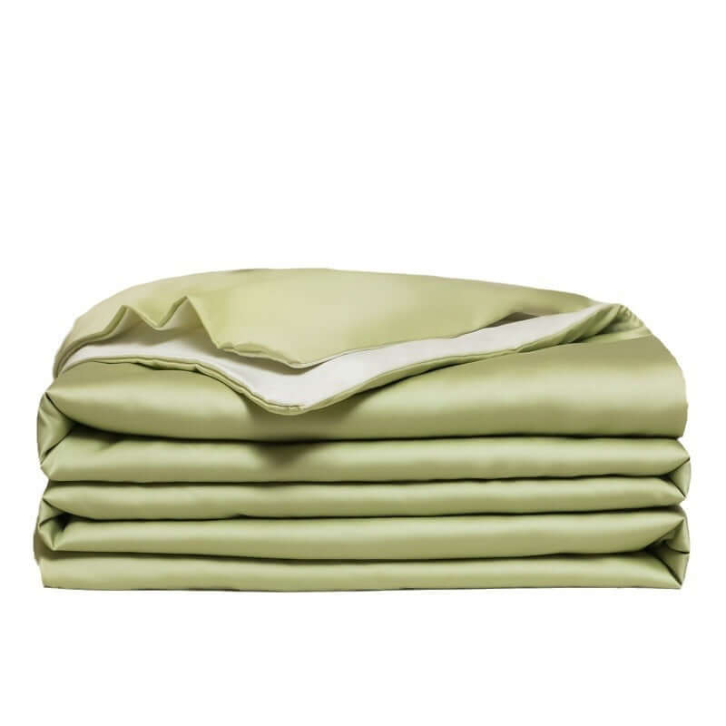 Washed Ice Silk Solid Color Silky Sleep Naked Bed Sheet Quilt Cover in soft green color, neatly stacked.
