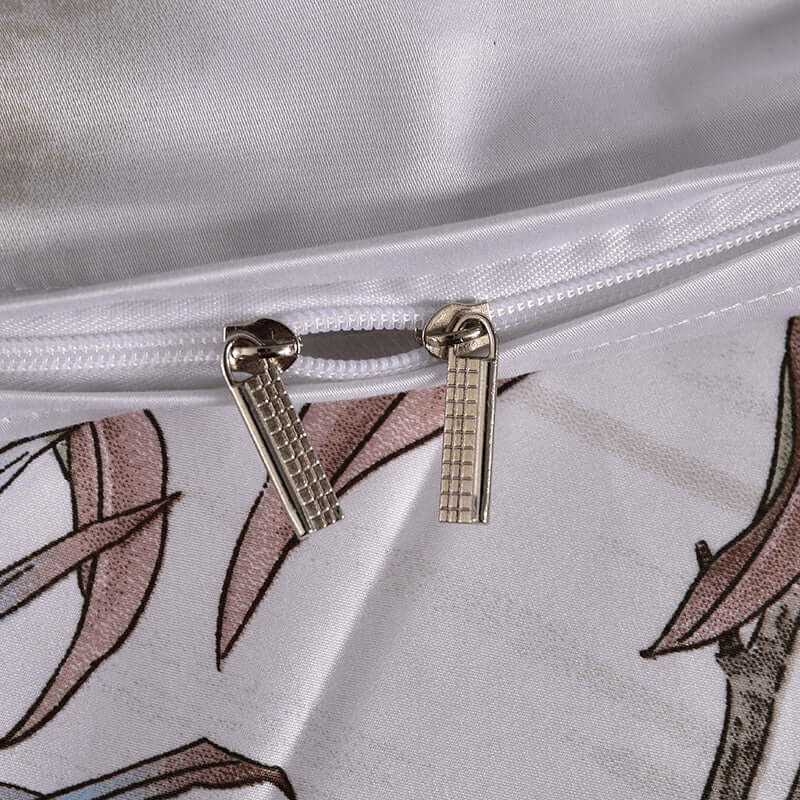 Close-up of high-end satin duvet cover zipper detail with plant printing design.
